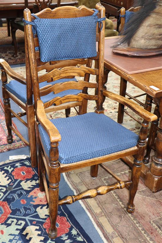 A set of eight 18th century style elm and beech ladderback dining chairs (two with arms)